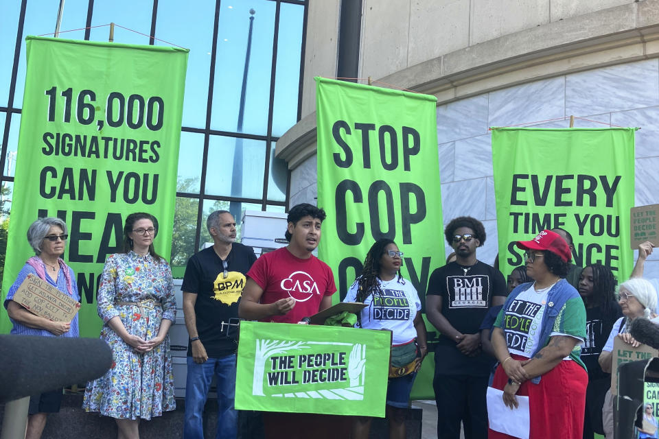 Activist Alberto Feregrino speaks at a news conference outside Atlanta City Hall, Monday, Sept. 11, 2023, to celebrate the gathering of what organizers said was 116,000 signatures to force a referendum on the future of a planned police and firefighter training center. Shortly after, though, Atlanta officials refused to accept the paperwork for processing, saying the city is awaiting a court decision over whether the petitions had been turned in on time. (AP Photo/R.J. Rico)