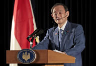 Japanese Prime Minister Yoshihide Suga speaks to the media during a press conference in Jakarta, Indonesia, Wednesday, Oct. 21, 2020. Suga is on a four-day visit to Vietnam and Indonesia. (AP Photo/Dita Alangkara, Pool)