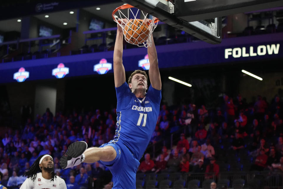 Creighton center Ryan Kalkbrenner (11) dunks against UNLV during the first half of an NCAA college basketball game Wednesday, Dec. 13, 2023, in Henderson, Nev. (AP Photo/John Locher)