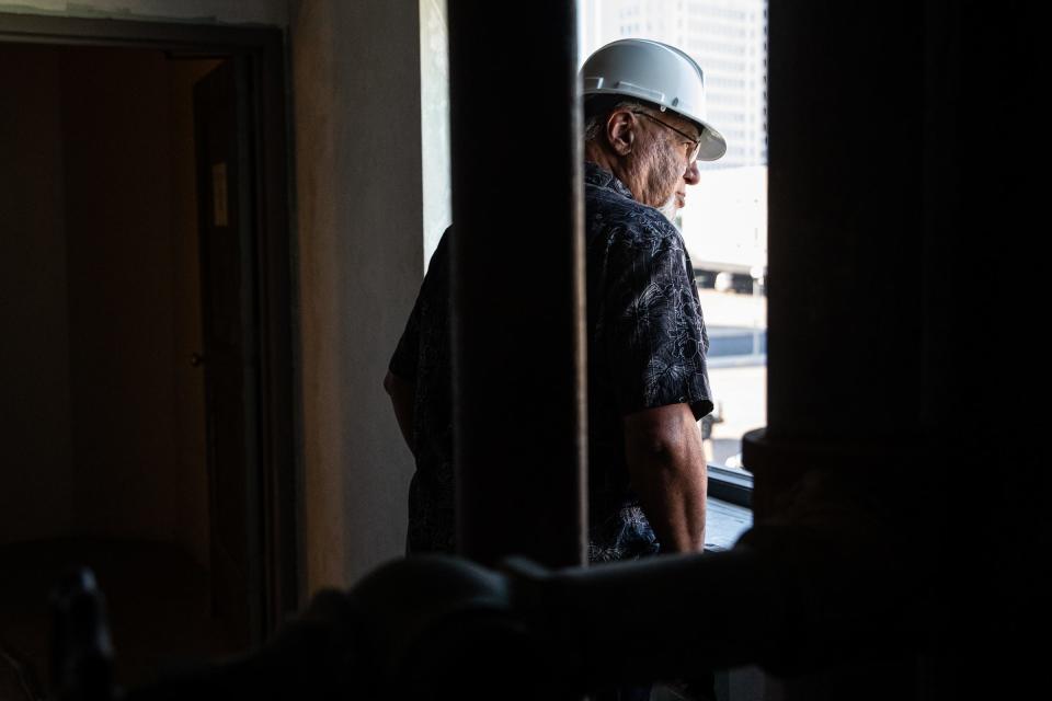 Arnold G. Zuniga looks out a second-story window in a Texas A&M University-Corpus Christi building downtown during a tour on Wednesday.