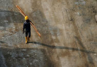 A worker walks at the construction site where locally transmitted Zika cases were first discovered in Singapore August 31, 2016. REUTERS/Edgar Su