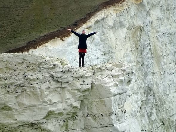 Couple risk lives playing 'chicken' on 200ft crumbling cliff edge