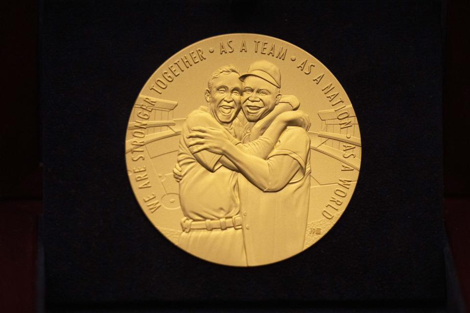 One side of a Congressional Gold Medal struck to honor baseball player Larry Doby is displayed at the Capitol, Wednesday, Dec. 13, 2023, in Washington. (AP Photo/Mark Schiefelbein)