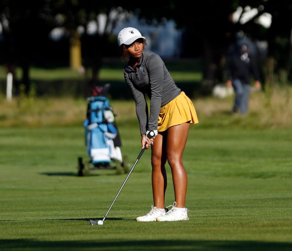 Penn senior Jill Daniels lines up a shot on the 6th hole during the IHSAA girls golf sectional tournament Friday, Sept. 15, 2023, at Knollwood Country Club in Granger.