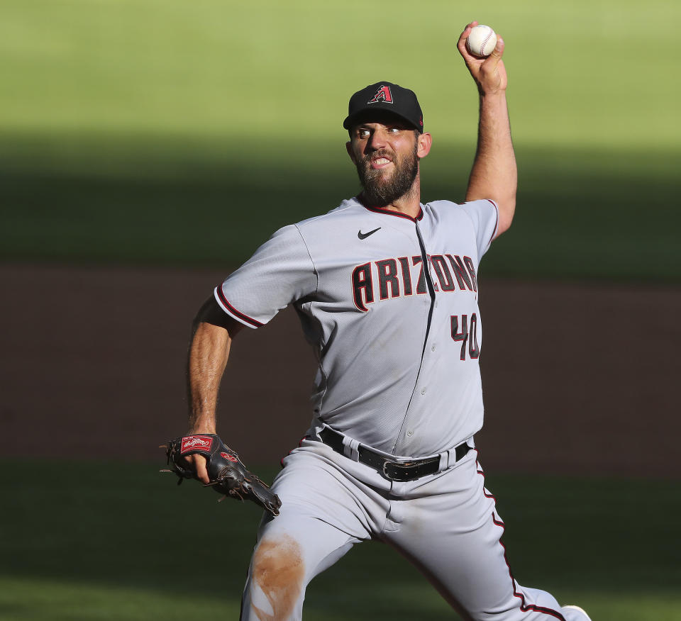 Arizona Diamondbacks starting pitcher Madison Bumgarner delivers during the sixth inning of the second game of a double header against the Atlanta Braves Sunday, April 25, 2021, in Atlanta. (Curtis Compton/Atlanta Journal-Constitution via AP)