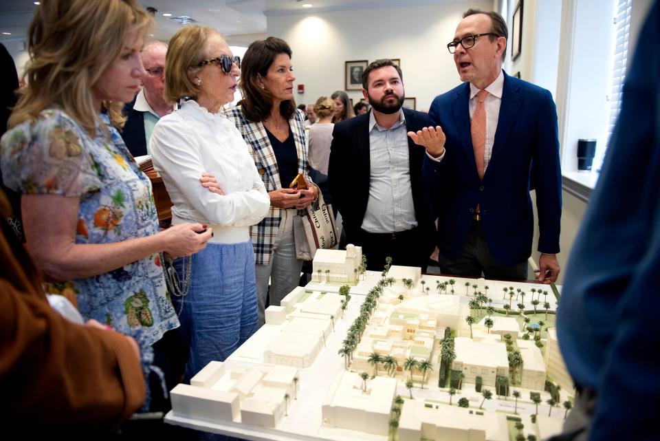 Daniel Lobitz, right, of of Robert A.M. Stern Architects talks to people who are attending the Development Review meeting Town Council chambers about possible architectural plans for the Paramount Building Wednesday January 10, 2024 in Palm Beach.