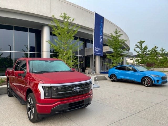 A Ford F-Series pickup truck and Mustang Mach-E parked outside the Ford Experience Center in Dearborn for Capital Markets Day on May 22, 2023.