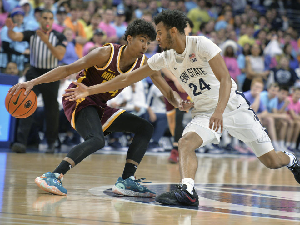 Penn State's Zach Hicks (24) attempts a steal the ball from Minnesota's Cam Christie (24) during the first half of an NCAA college basketball game Saturday, Jan. 27, 2024, in State College, Pa. (AP Photo/Gary M. Baranec)