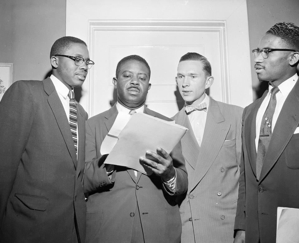 The Rev. Ralph D. Abernathy, center, speaks with attorney Fred D. Gray and the Rev. Robert S. Graetz about the bus boycott settlement in Montgomery on Feb. 21, 1956.
Rev. Ralph D. Abernathy, center, speaks with attorney Fred D. Gray, left, and the Rev. Robert S. Graetz, right of Abernathy, about the bus boycott settlement in Montgomery, Ala., on Feb. 21, 1956.  (AP Photo)