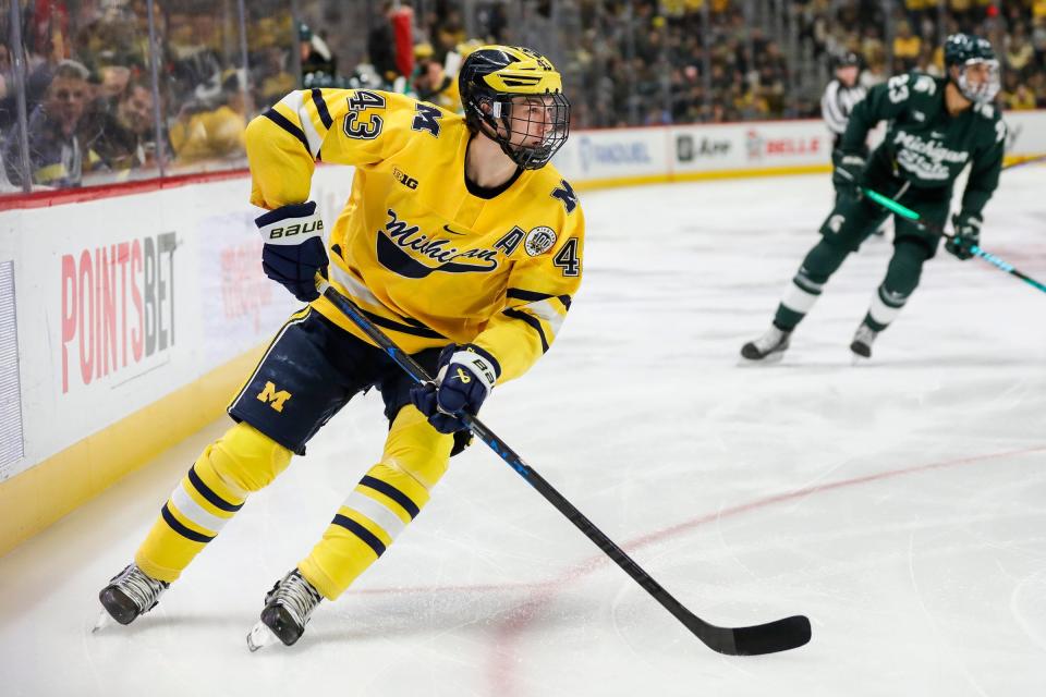 Michigan forward Gavin Brindley (4) looks to pass against Michigan State during the first period of Duel in the D at Little Caesars Arena in Detroit on Saturday, February 11, 2023.
