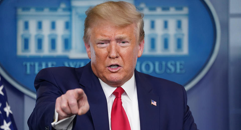 U.S. President Donald Trump points at a reporter as he talks about the Department of Health and Human Services Inspector General's report on the shortage of coronavirus tests