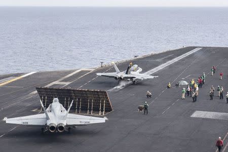 A U.S. Navy F/A-18C Hornet launches from the flight deck of aircraft carrier USS Harry S. Truman in the Mediterranean Sea June 3, 2016. U.S. Navy/Mass Communication Specialist 3rd Class Bobby J Siens/Handout via Reuters