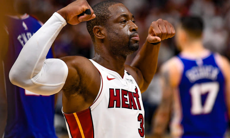 Dwyane Wade flexing his muscles.