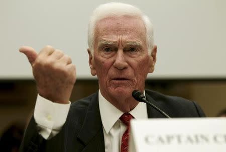 Eugene Cernan, commander of Apollo 17 and the last man on the moon, testifies during a House Science, Space and Technology committee hearing on "NASA Human Spaceflight Past, Present and Future: Where Do We Go From Here?" in Washington September 22, 2011. REUTERS/Molly Riley/Files