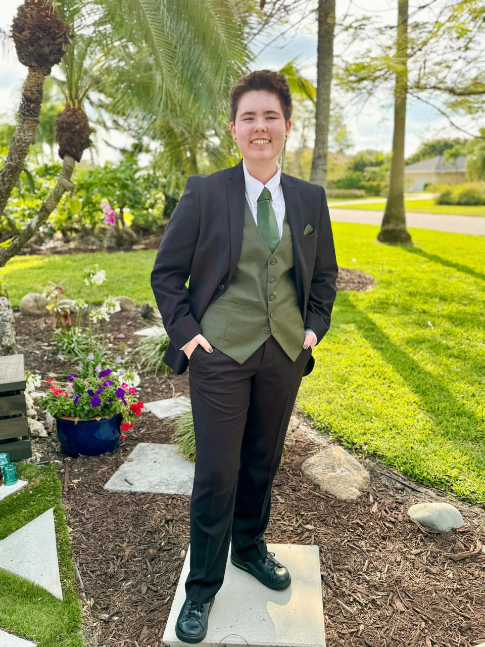 Sophie Savidge smiles wearing prom outfit