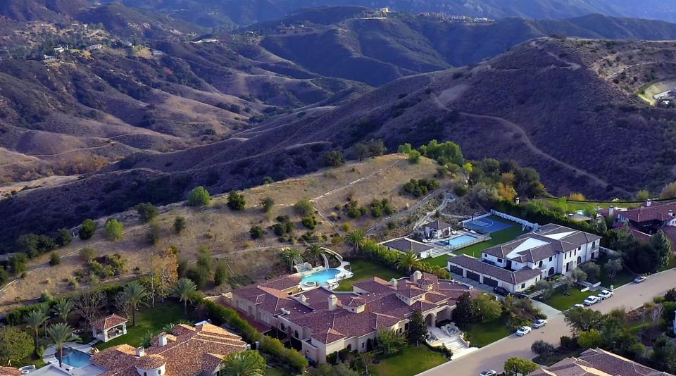 Behind the house is a beautiful view of rolling hills