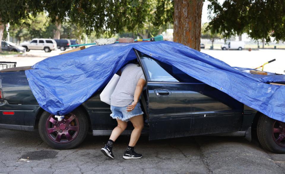 Olga V. Romero lives in her car with her 23-year-old son in South Los Angeles.