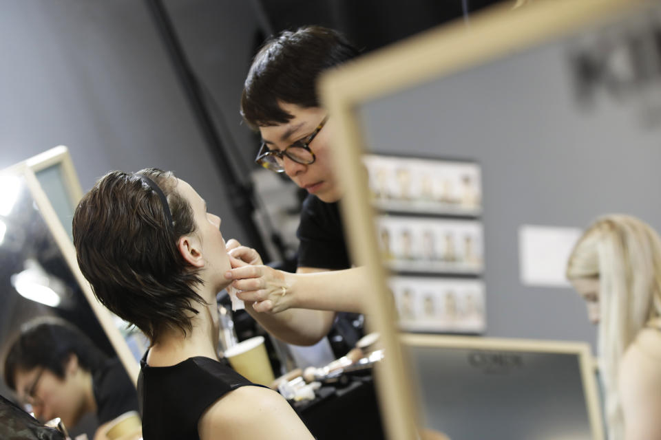 A model has make up applied backstage prior to the N. 21 Spring-Summer 2020 collection, unveiled during the fashion week, in Milan, Italy, Wednesday, Sept. 18, 2019. (AP Photo/Luca Bruno)