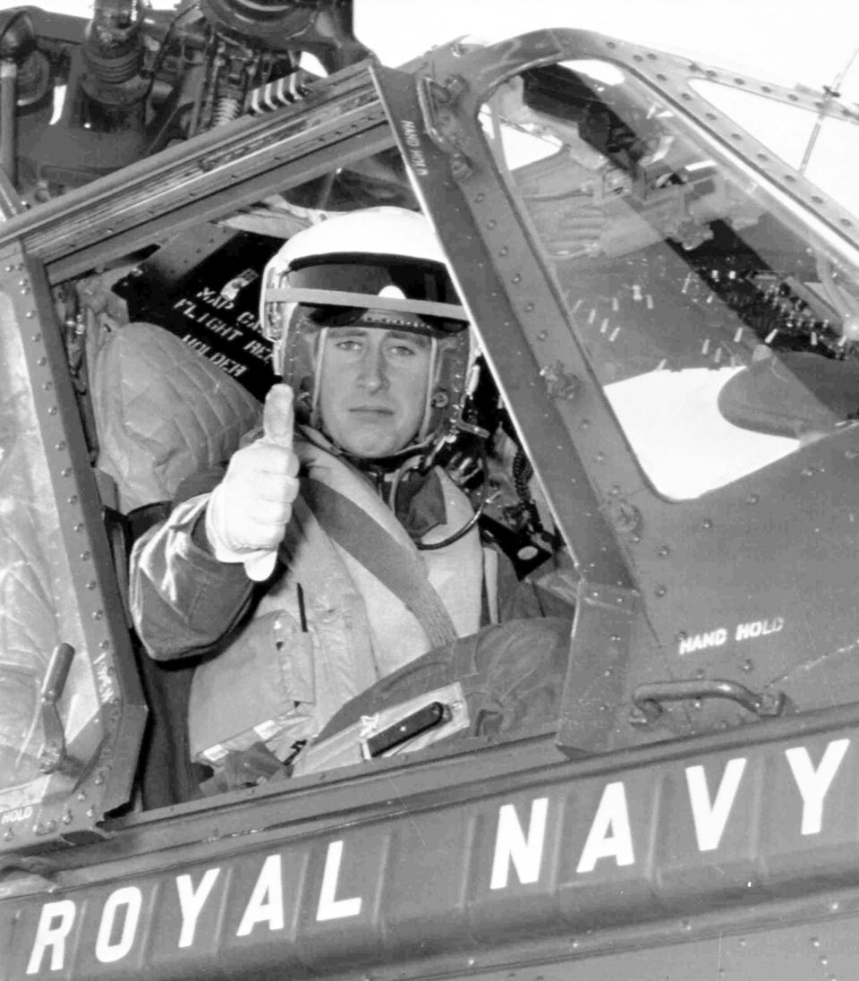 Britain's Prince Charles gives a thumbs-up sign as he prepares to take off in a Wessex Helicopter on a training flight from Yeovilton Royal Navy Air Station, Somerset, on Oct. 21, 1972.