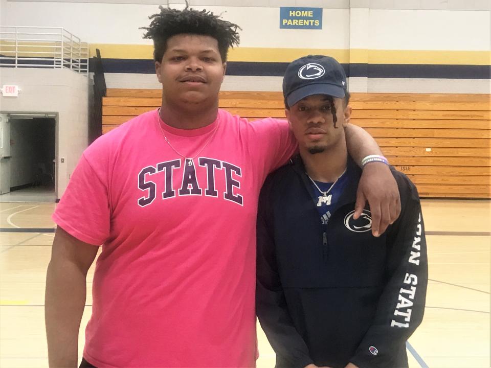 Catholic Memorial's Donvovan Harbour (left) and Corey Smith pose for a picture after Smith announced his commitment to Penn State's football program on Friday April 28, 2023 at Catholic Memorial High School in Waukesha, Wis. Harbour is also a Penn State recruit.