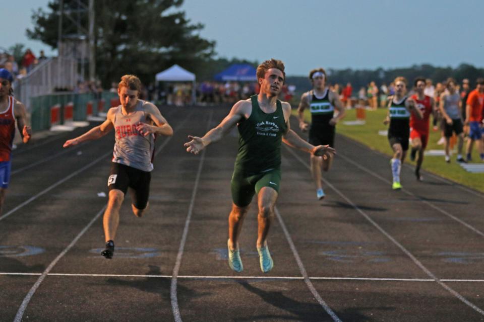 Oak Harbor's Hayden Buhro wins the 200 in the SBC Bay Division.