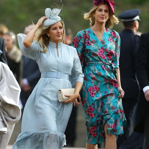 Ellie Goulding, left, arrives for the wedding - Credit: Getty