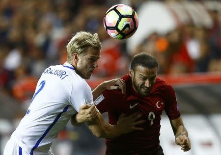 Football Soccer - Turkey v Finland - 2018 World Cup Qualifying European Zone - Antalya arena, Antalya, Turkey - 24/3/17 Turkey's Cenk Tosun and Finland's Paulus Arajuuri in action. REUTERS/Murad Sezer