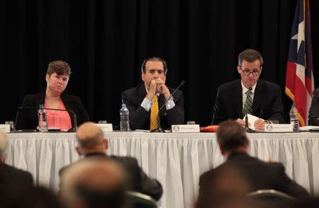 Chairman of Puerto Rico's fiscal control board Jose Carrion III (2nd L), members of the board Ana Matosantos (L) and David Skeel attend a meeting of the Financial Oversight and Management Board for Puerto Rico at the Convention Center in San Juan, Puerto Rico March 31, 2017. Picture taken March 31, 2017. REUTERS/Alvin Baez