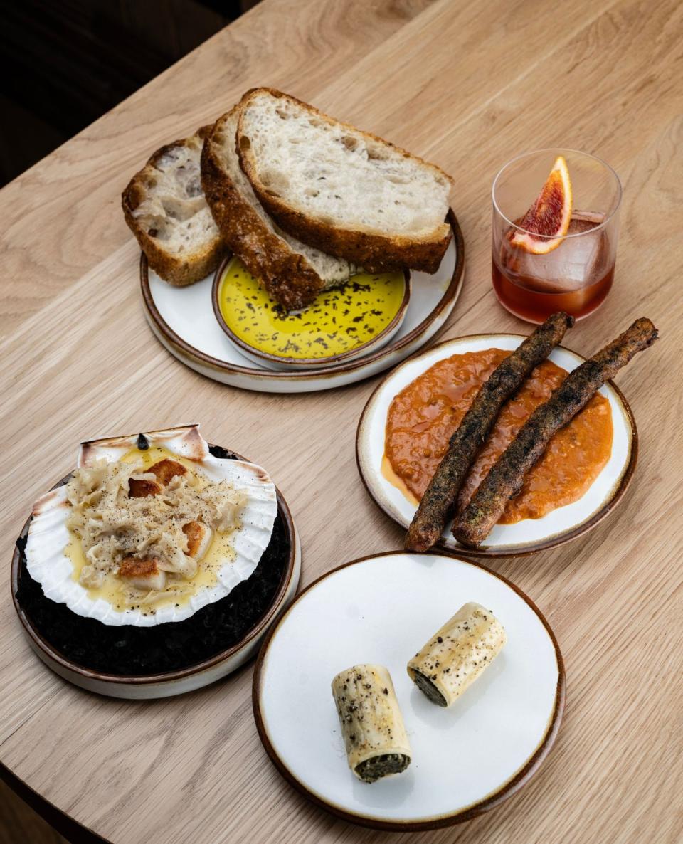 Pepperdulse focaccia, with saltcod churros, Spanakopita, scallops, and cauliflower mushroom (Daniel Hambury/Stella Pictures Ltd)