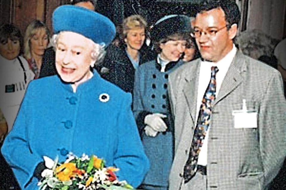 Peter Fisher, pictured with the Queen, was killed in a crash in Holborn ()