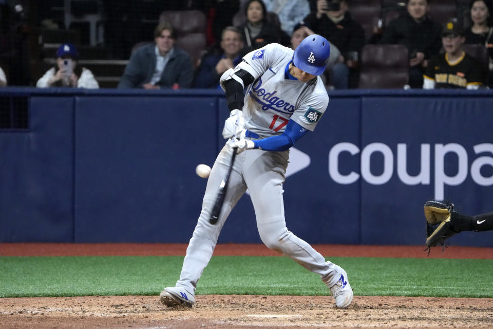 Los Angeles Dodgers designated hitter Shohei Ohtani hits an RBI single during the eighth inning of an opening day baseball game against the San Diego Padres at the Gocheok Sky Dome in Seoul, South Korea Wednesday, March 20, 2024, in Seoul, South Korea. (AP Photo/Ahn Young-joon)