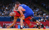 LONDON, ENGLAND - AUGUST 06: Karam Mohamed Gaber Ebrahim of Egypt competes with Nenad Zugaj of Croatia (R) during their Men's Greco-Roman 84 kg Wrestling 1/8 Final bout on Day 10 of the London 2012 Olympic Games at ExCeL on August 6, 2012 in London, England. (Photo by Cameron Spencer/Getty Images)