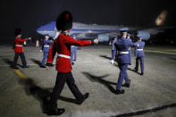 Military personnel march as Air Force One, carrying U.S. President Joe Biden and First Lady Jill Biden arrives at Cornwall Airport Newquay, near Newquay, England, ahead of the G7 summit in Cornwall, Wednesday, June 9, 2021. (Phil Noble/Pool Photo via AP)