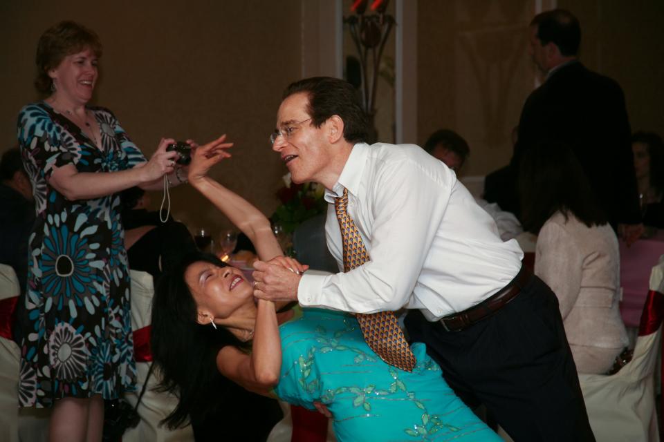 Yuko and Dave Love, of Newtown Township, dance at a friend's wedding in 2009.