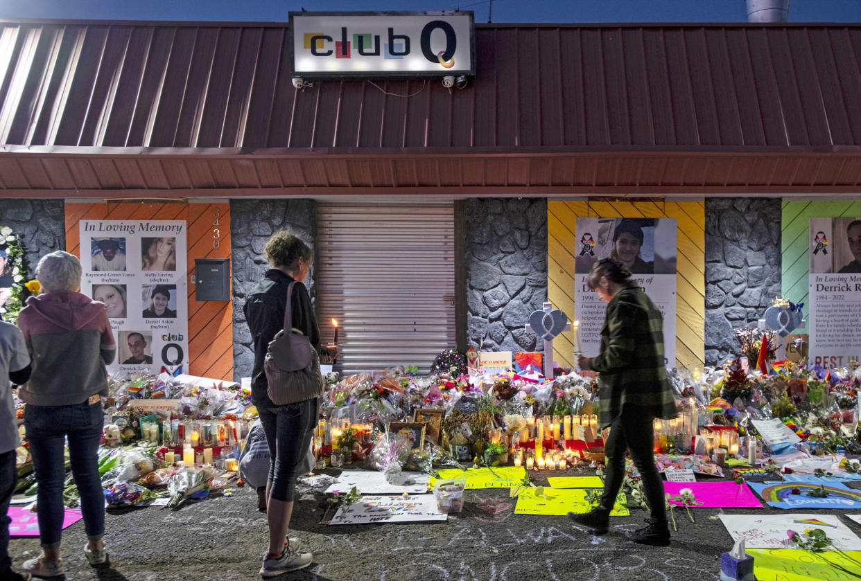 Mourners gather at a memorial for the victims of a mass shooting at Club Q (Parker Seibold / The Gazette via AP file)