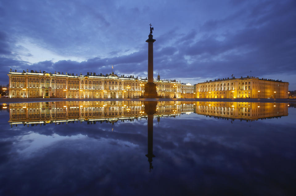 Winter Palace and the Alexander Column are reflected in a puddle after the rain at the Palace Square in St. Petersburg, Russia, Monday, April 27, 2020. (AP Photo/Dmitri Lovetsky)