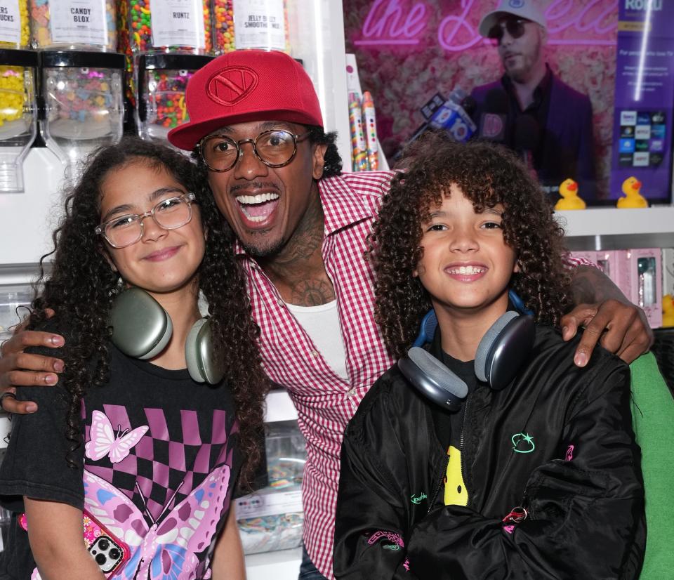Moroccan Cannon, Nick Cannon and Monroe Cannon attend the Natti Natasha & Nick Cannon host Sugar Factory in Times Square on August 11, 2023 in New York City.