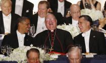 U.S. President Barack Obama (L) and Republican presidential candidate Mitt Romney share a laugh with Cardinal Timothy Dolan (C) at the 67th Annual Alfred E. Smith Memorial Foundation dinner in New York, October 18, 2012. REUTERS/Jason Reed (UNITED STATES - Tags: POLITICS RELIGION USA PRESIDENTIAL ELECTION ELECTIONS TPX IMAGES OF THE DAY)