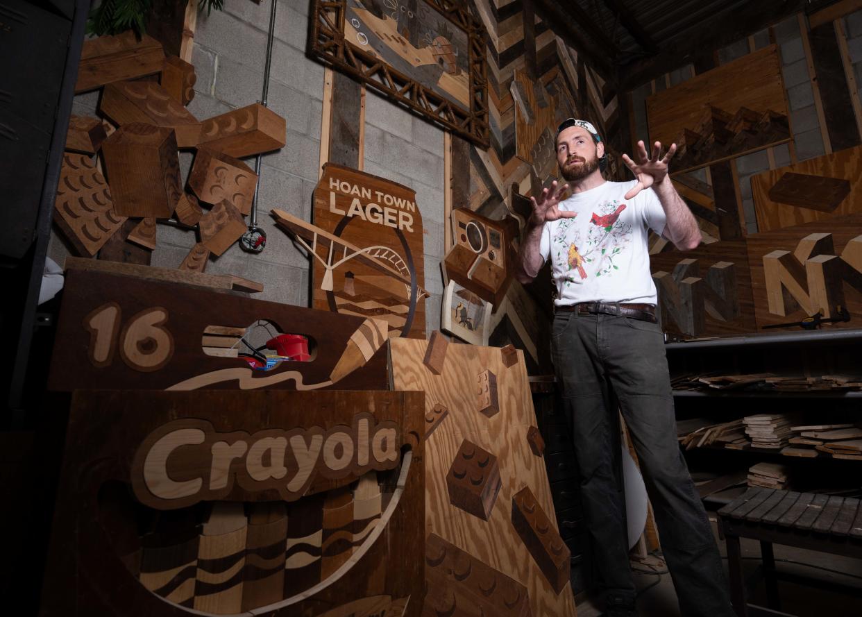 Wisconsin wood artist Ike Wynter, who uses discarded wood to make art that focuses on nostalgia and mental health awareness, explains his process on Wednesday, June 12, 2024, in Butler, Wisconsin.