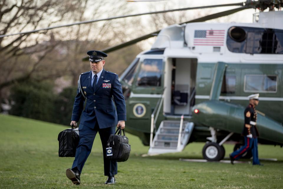 A US military aide carries the "president's emergency satchel."