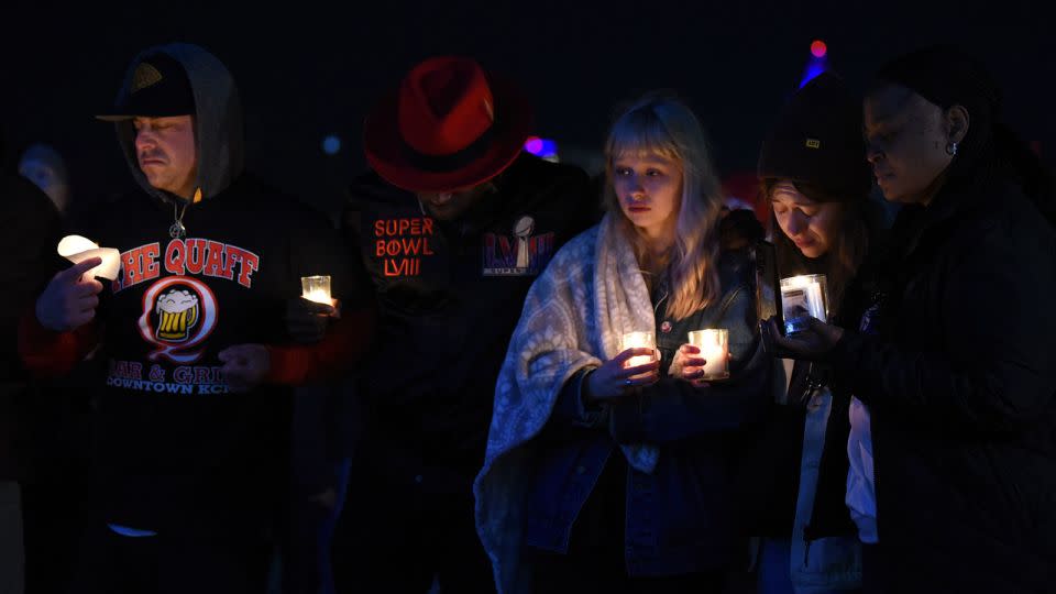 People hold candles during a vigil in Kansas City on Thursday. - Emmalee Reed/CNN