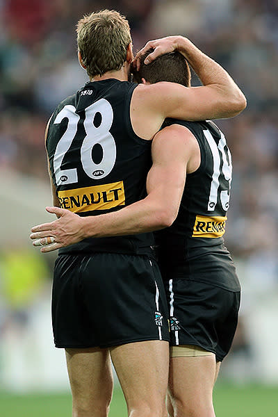 Port Adelaide celebrate their big win that sens them top of the AFL ladder.