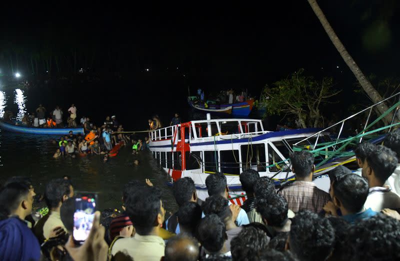 Rescuers search for survivors after a boat capsized off the coastal town of Tanur