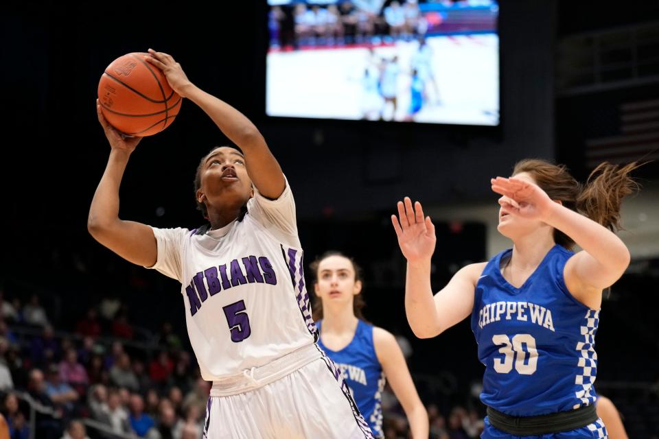 Africentric's Samairah Thompson is defended by Chippewa's Jaclyn Jundzilo during the state final.