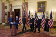 Treasury Secretary Steve Mnuchin, third from left, steps back after speaking as Defense Secretary Mark Esper, second from right, prepares to speak at a news conference to announce the Trump administration's restoration of sanctions on Iran, Monday, Sept. 21, 2020, at the U.S. State Department in Washington. Also pictured are from left, National Security Adviser Robert O'Brien, Commerce Secretary Wilbur Ross, Mnuchin, Secretary of State Mike Pompeo, Esper and U.S. Ambassador to the United Nations Kelly Craft. (AP Photo/Patrick Semansky)