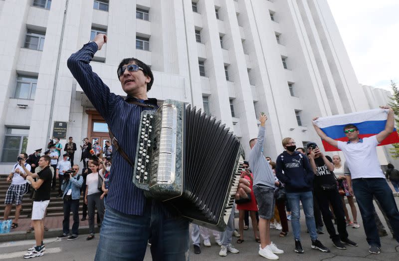 A man plays the accordion during a rally in support of former regional governor Sergei Furgal in Khabarovsk