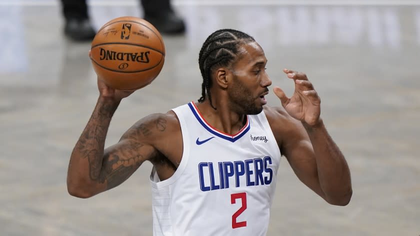 Los Angeles Clippers forward Kawhi Leonard (2) keeps the ball away from Brooklyn Nets.