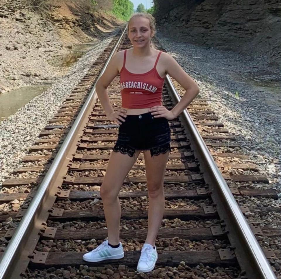 Kenslee Brandon was photographed on railroad tracks during a family vacation to Kentucky in June 2020, one month before she passed away.