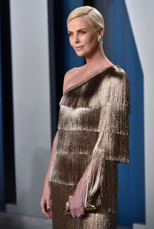 Charlize Theron arrives for the Vanity Fair Oscar party at the Wallis Annenberg Center for the Performing Arts in Beverly Hills, Calif., on February 9, 2020. The actor turns 48 on August 7. File Photo by Chris Chew/UPI