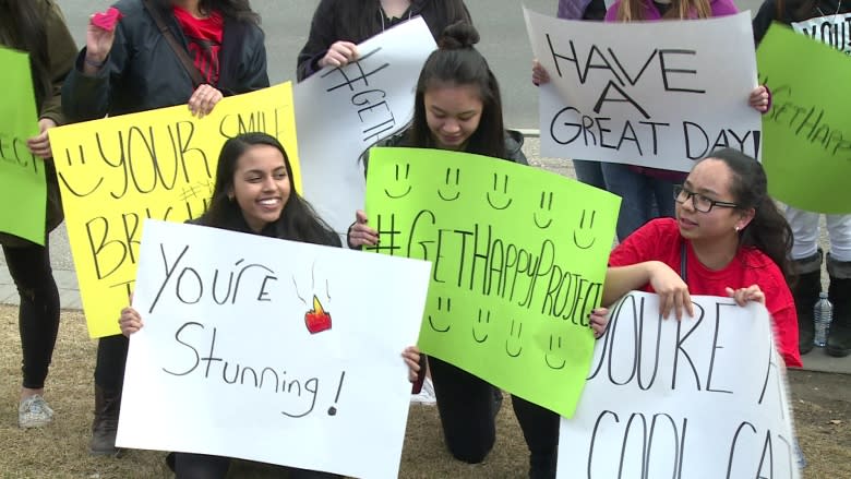 Calgary youth try to make people smile